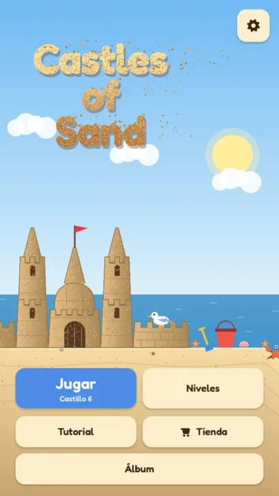 Pantalla de inicio con un castillo de arena en la playa